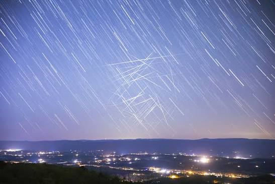 Satellite flare visible in the night sky — an increasingly common source of UAP misidentification reports